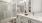 a bathroom with a tub, sink, and toilet