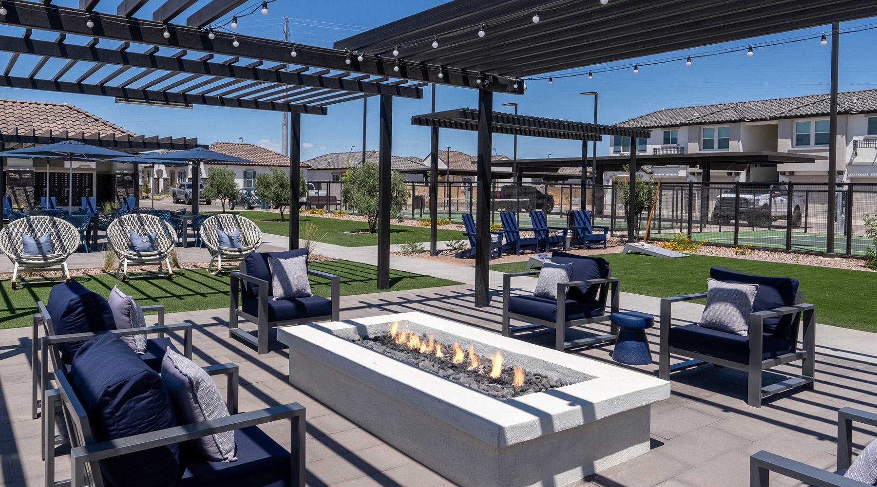 a firepit surrounded by chairs