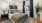 a bedroom with a bed and a plant